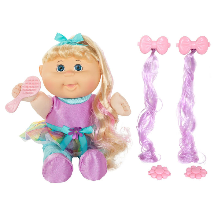 An 11-inch doll with blonde hair, blue eyes, wearing a purple outfit, accompanied by a brush and additional hair accessories.