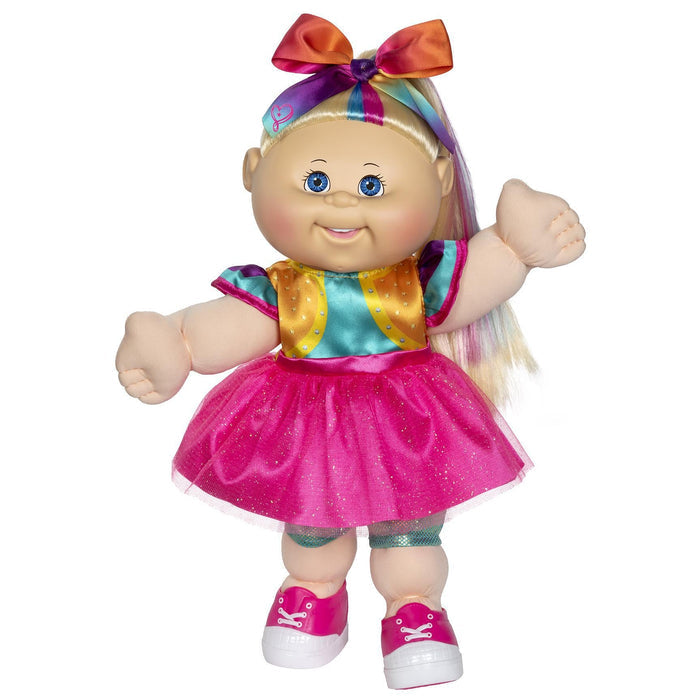 A 14-inch doll with blonde hair, blue eyes, wearing a pink skirt, multicolored top, and pink sneakers. The doll has a bow in its hair and appears to be smiling.