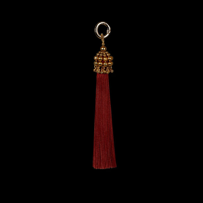 beaded polyester tassel in gold and burgundy threads by object and dawn