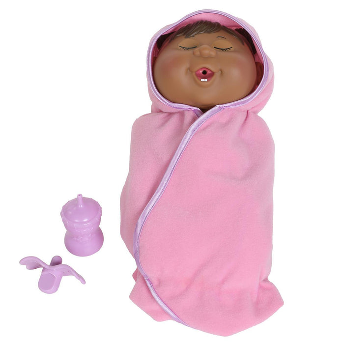 A 9-inch doll depicting a newborn in a pink blanket with a pacifier and a bottle, designed to look like the Doll cabbage patch kids.