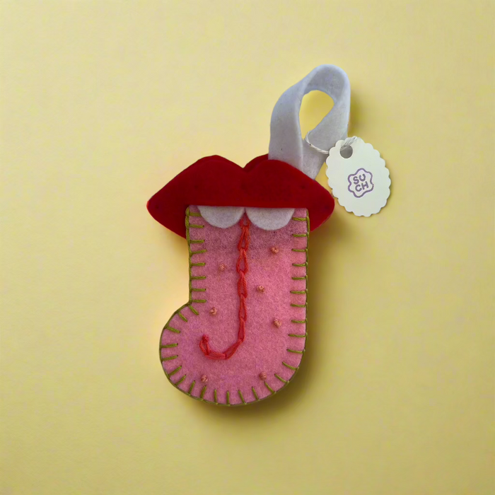 Suzan Choy: Tongue Out Stocking Ornament