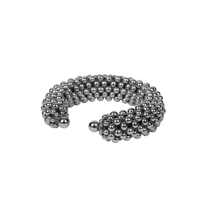 Object & Dawn beaded wrist accessory in ivory, structured artemisia supple cuff with polymer metal beads, ghost image side view