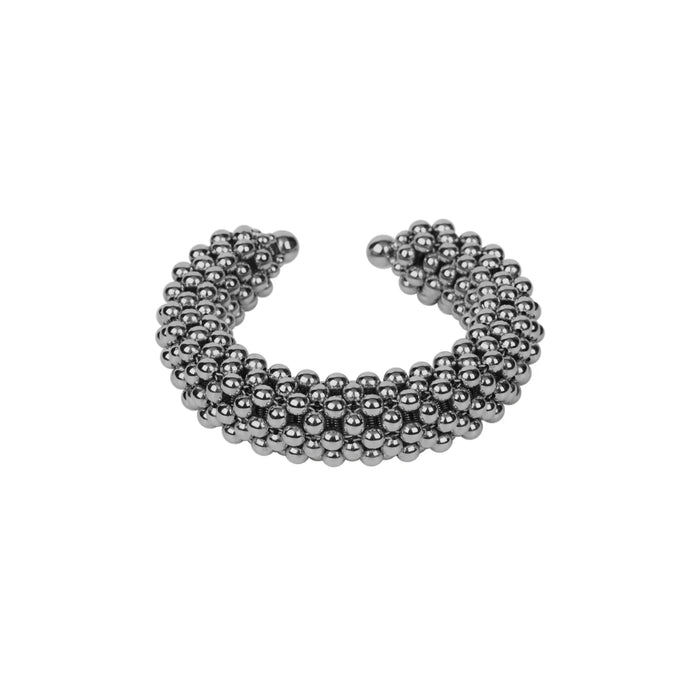 Object & Dawn beaded wrist accessory in ivory, structured supple cuff with polymer metal beads, ghost image front view