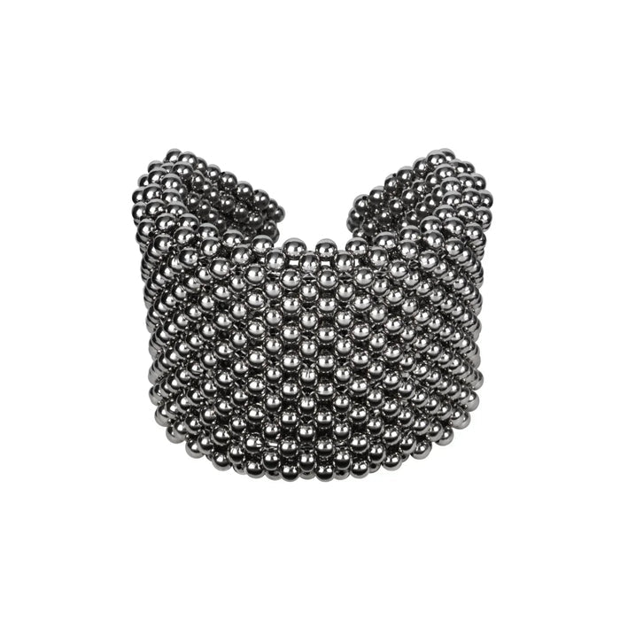 Object & Dawn beaded wrist accessory in ivory, structured supple cuff with polymer metal beads, ghost image