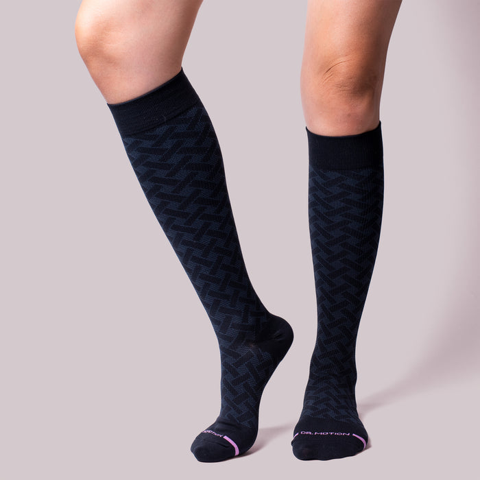 Knee-high compression socks with a basket weave pattern in dark blue.