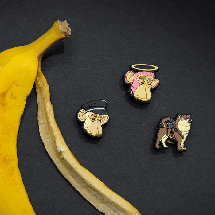 Bored Apes Popinz 3 Pack on black background next to a banana peel