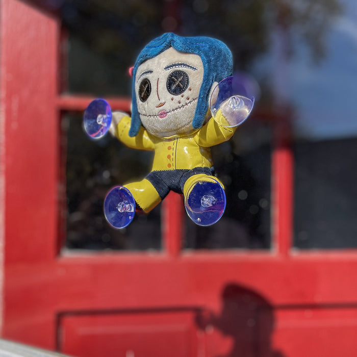 Coraline plush window clinger featuring button eyes, soft fabric, and vibrant colors, perfect for decorative window display.