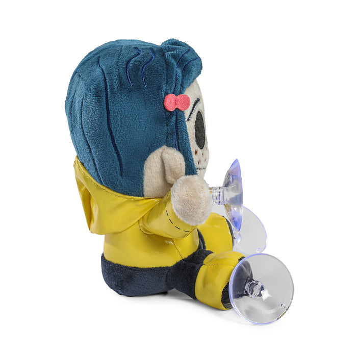 Coraline plush window clinger featuring button-eyed Coraline character, designed to attach to windows for decorative display.