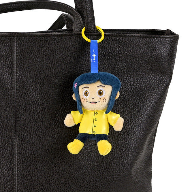 Coraline plush charm from the Coraline brand, featuring a soft, colorful plush character in a pre-order collectible charm.