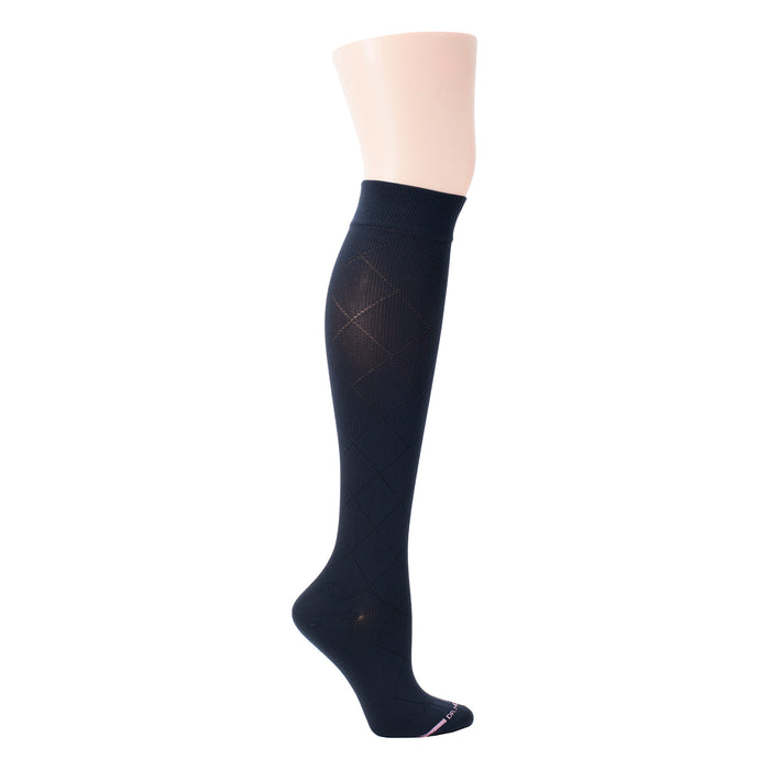 Knee-high compression sock in navy blue with a diamond pattern and a ribbed cuff.