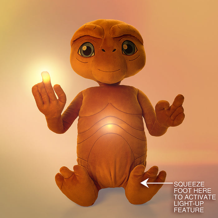 E.T. the Extra-Terrestrial 13-inch interactive plush toy with light-up chest and finger, soft and cuddly for fans of the film.