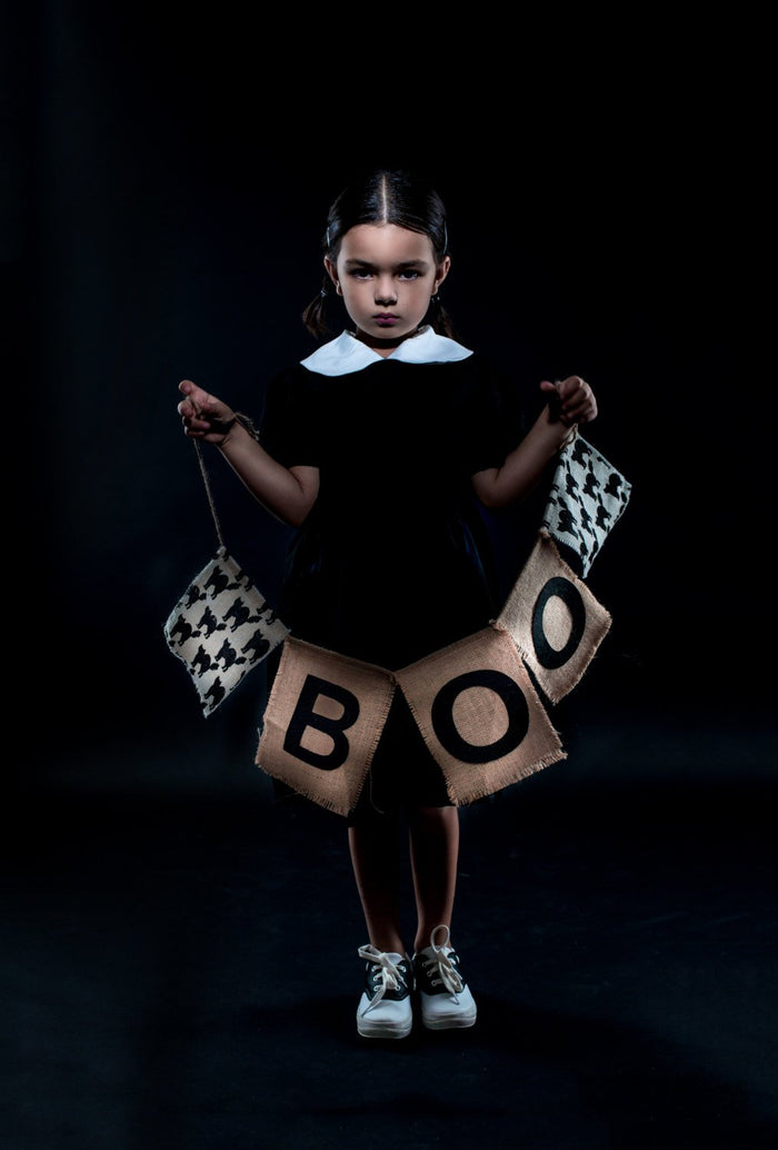 Girl wearing dress, Girl holding "Boo" sign