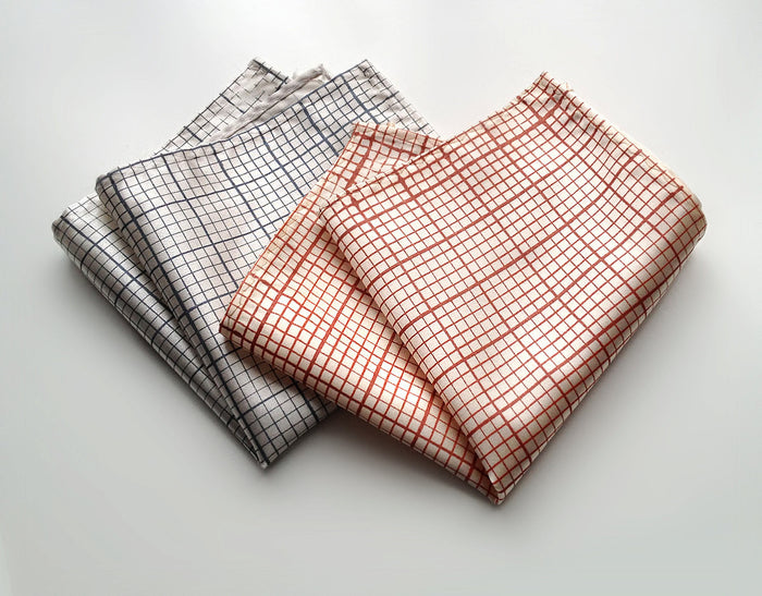 Graph Paper pocket square: steel on platinum; dark salmon on cream.