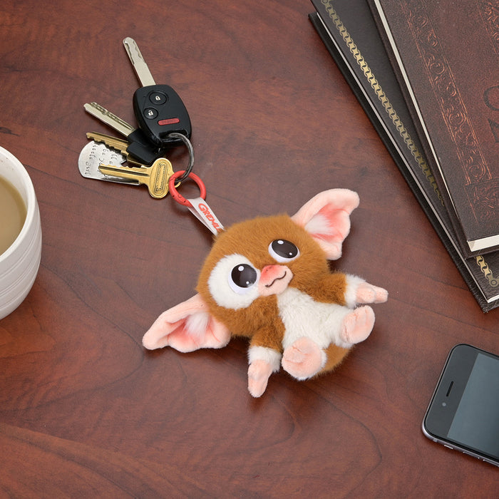 Gremlins Gizmo plush charm, a 4-inch soft plush toy from the Gremlins brand, featuring Gizmo's detailed design and charm.