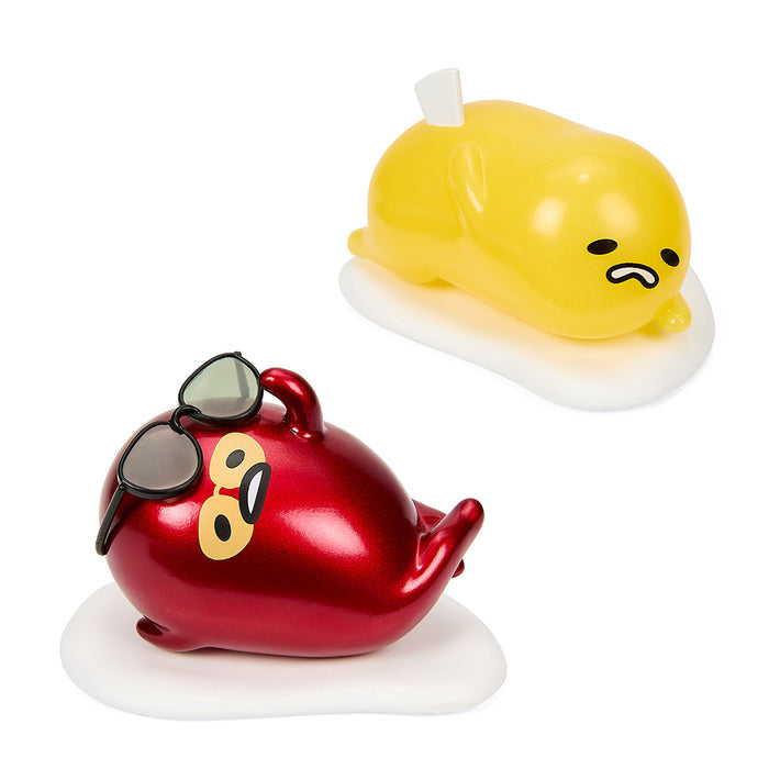 Two Gudetama the Lazy Egg vinyl art figures from Sanrio, featuring Gudetama in relaxed, humorous poses in a 2-pack.