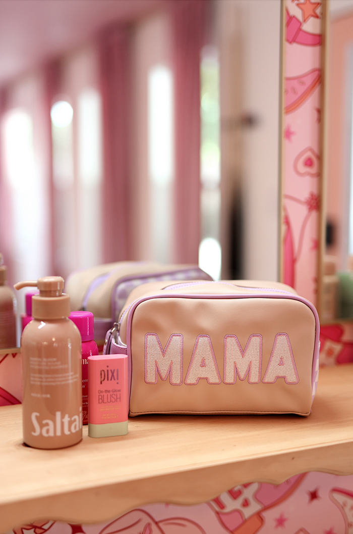 Stylish pink makeup bag with 'MAMA' lettering, perfect for organizing cosmetics and accessories.