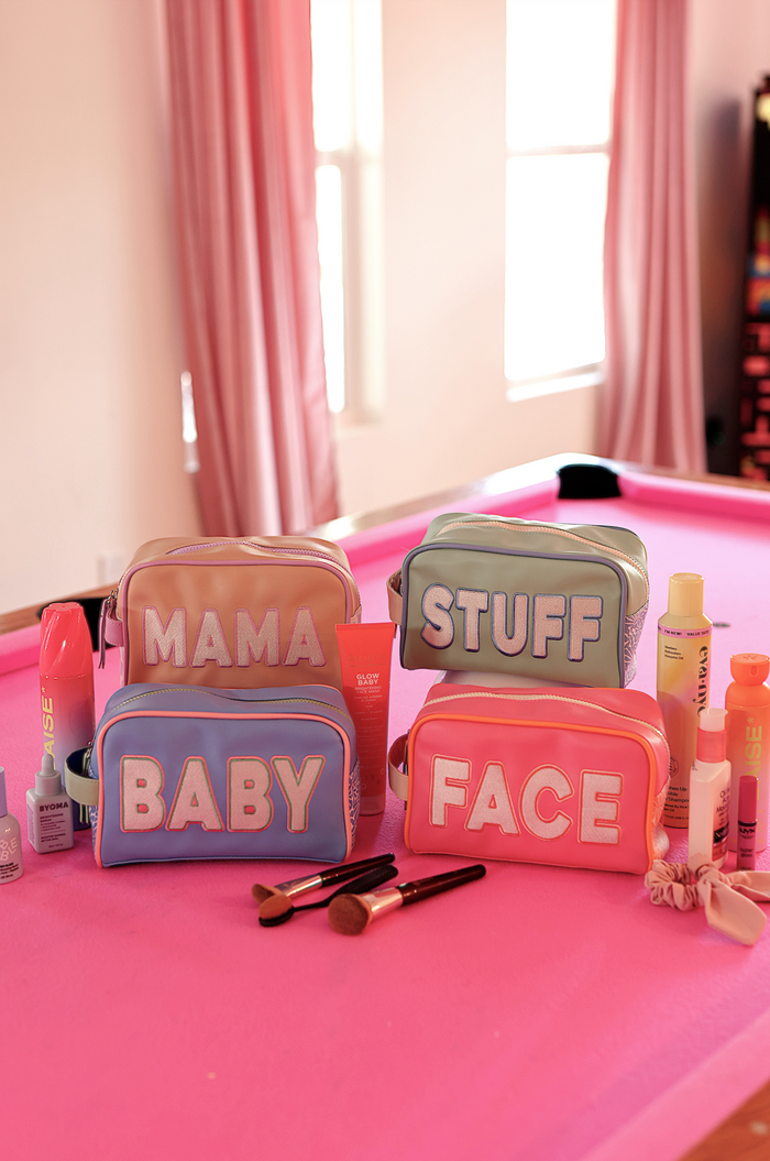 Colorful cosmetic bags set: 'MAMA', 'BABY', 'STUFF', 'FACE' in pink and blue with zipper closure.