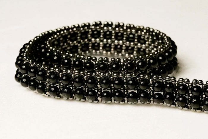 detail of beaded modular hat band for hat accecories by object and dawn in white background