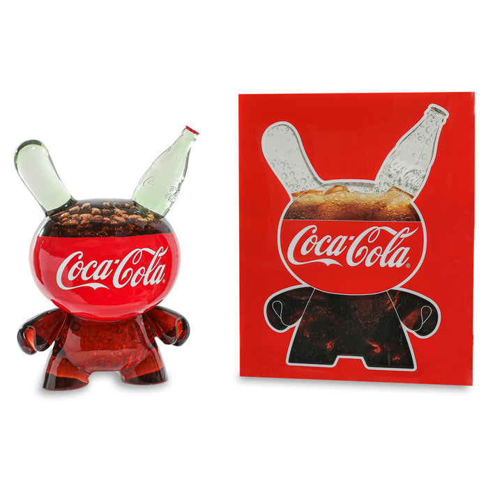 Limited edition 8-inch Coca-Cola resin Dunny art figure by Kidrobot, featuring a colorful Coca-Cola-themed design.