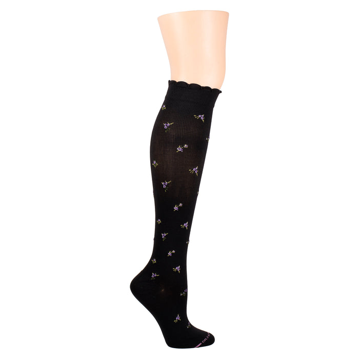 Knee-high black compression socks with a floral pattern and scalloped top.