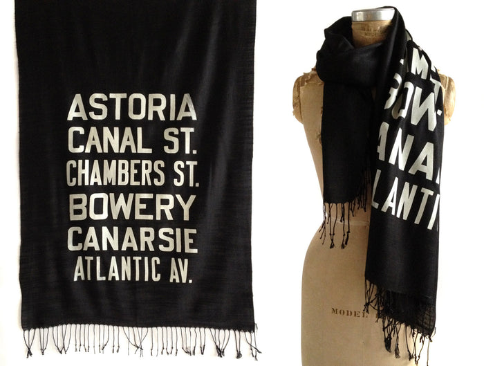 Ivory-cream ink on black light pashmina.