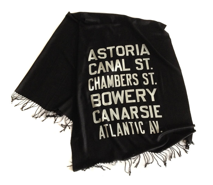 Ivory-cream ink on black light pashmina.