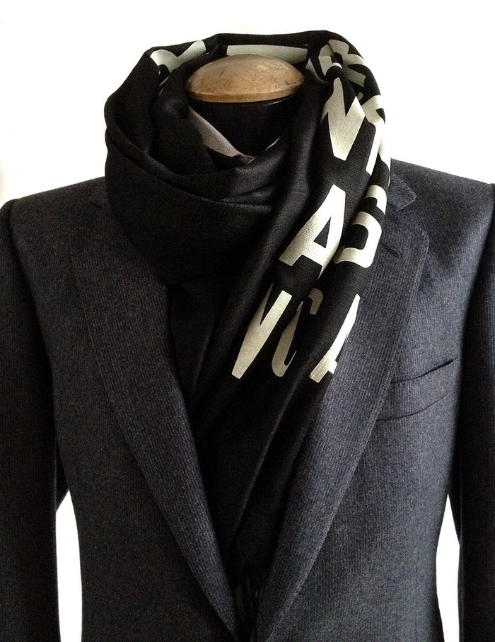 Ivory-cream ink on black light pashmina.