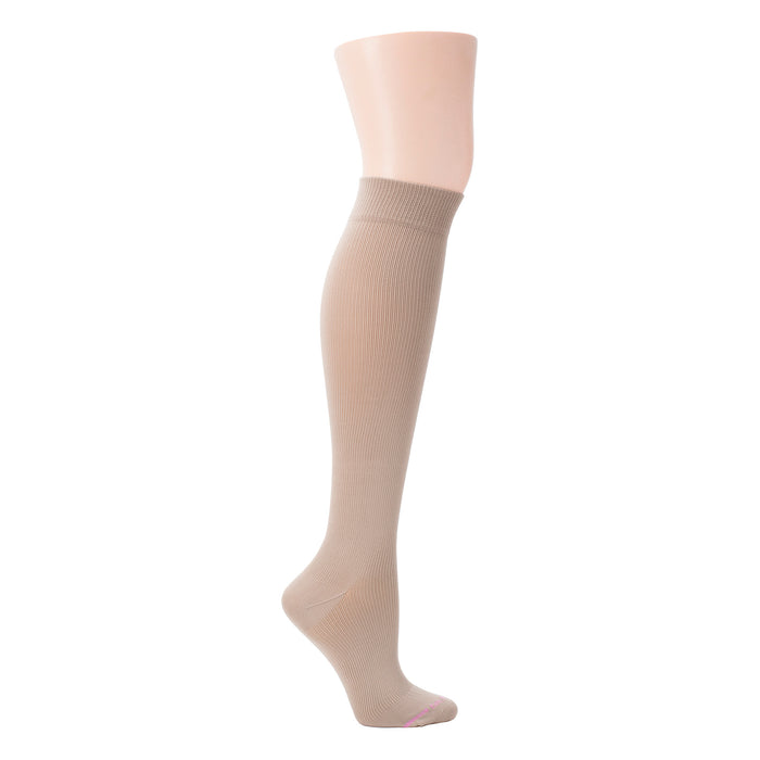 Knee-high compression sock in a solid beige color with a ribbed texture and a reinforced toe.