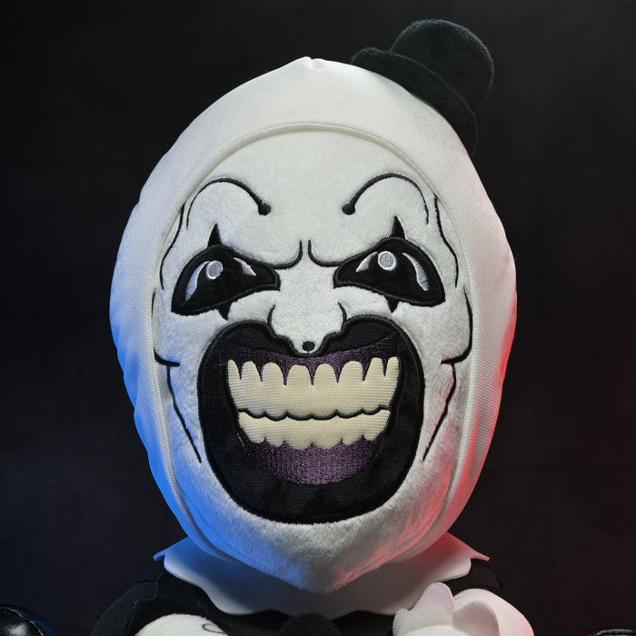 Large plush of Art the Clown from Terrifier 3, featuring detailed costume and expressive face, perfect for horror fans.