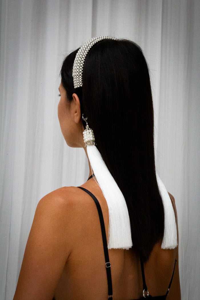 woman wear Teuta Headband pearl with trinity medallions in neutral background by object & dawn from back