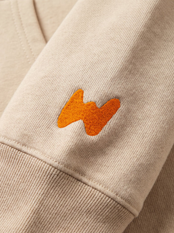 Fabric detail on the beige This Is My Happy Face Frenchie Hoodie from WOOF