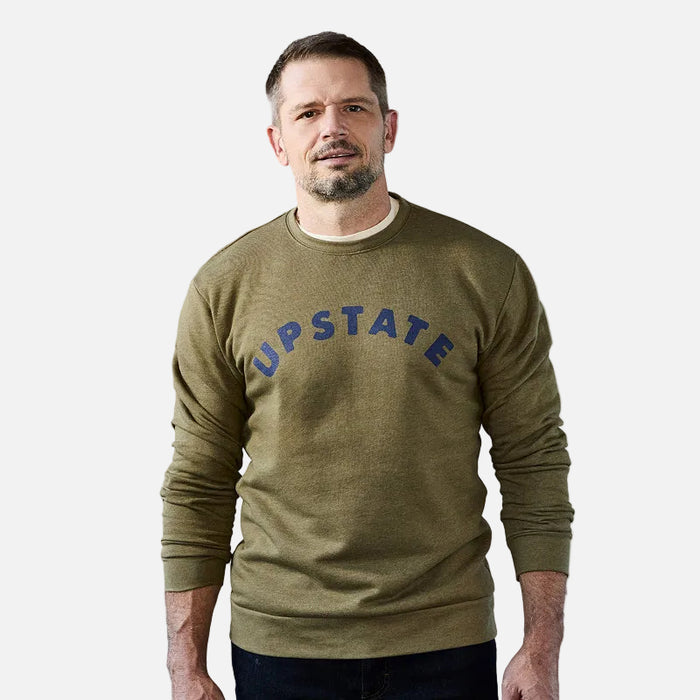 Man wearing a green sweatshirt with 'UPSTATE' text on a plain background